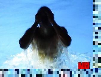 Athletic teen boy swims at nigth without his mask in his new pool.