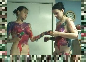 Sexy girls rub paint all over each other
