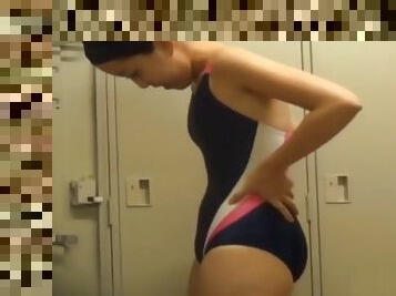 Asians in the locker room change into bathing suits