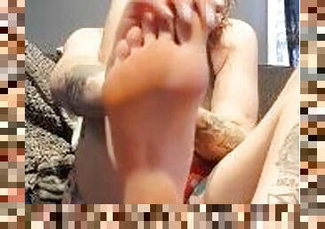 Tattooed Brunette Lotions Her Size 11 Feet After A Shower