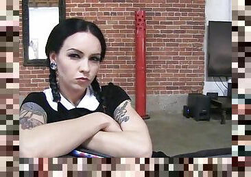 Tattooed punk getting flirty with her colleagues back stage