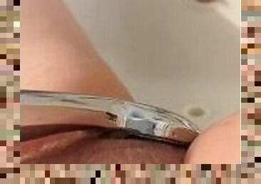 Using the shower head for pleasure
