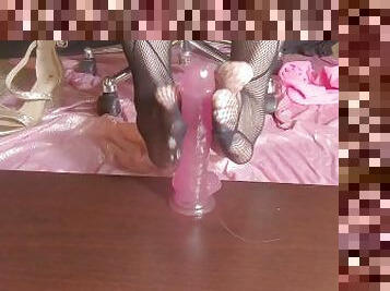 Cute feet in fishnets stroking pink dildo