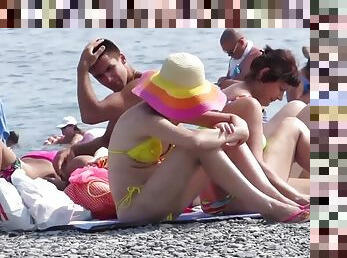 Strange white woman sunbathes flashing ass in lowered bikini