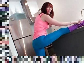 Flexible chick in spandex pants stretches