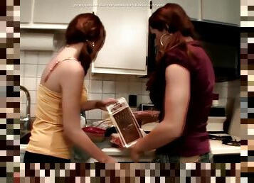 Lesbians having fun in kitchen