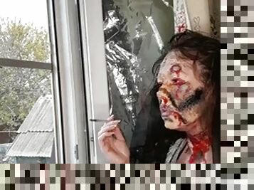 Wife smokes a cigarette makeup zombie