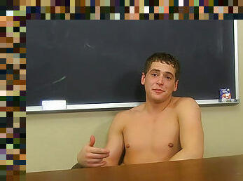 Naked amateur schoolboy in the classroom