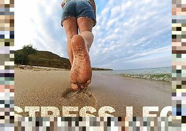 Barefoot Girl Walks Over The Summer Seashore