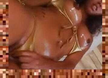 Black girl in bikini oiled up