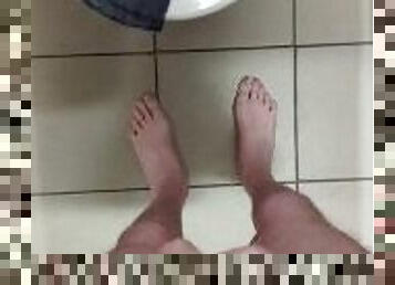 Stripping completely naked in public toilet