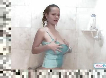 Busty slim teen enjoys solo pussy play in shower