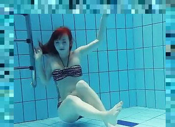 Russian redhead model with big tits Katrin Privesem swims